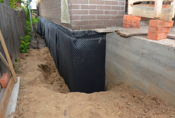 Happy homeowners after waterproofing job in Frenchtown
